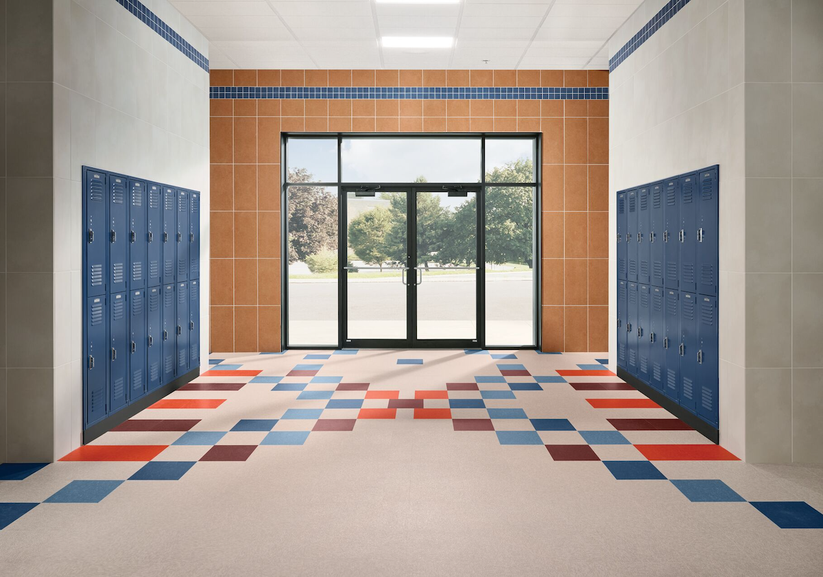 School hallway/entry with Armstrong resilient flooring and Crossville porcelain tile on walls
