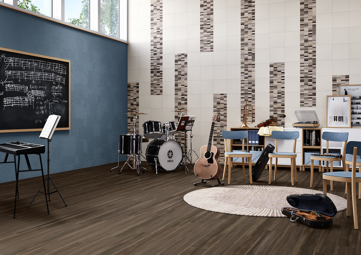 School music room with Armstrong resilient flooring and Crossville porcelain tile on walls